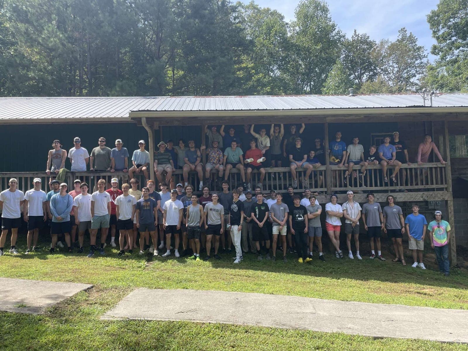 Dozens of fraternity brothers during a weekend retreat